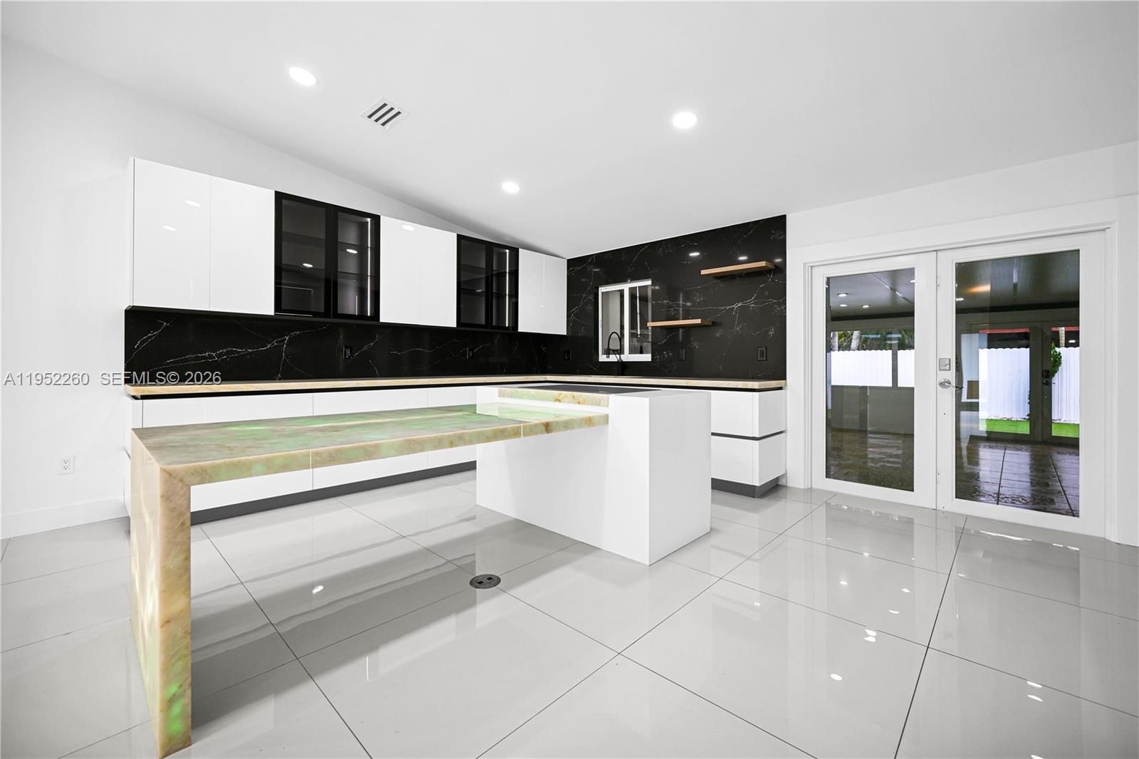 13284 Southwest 39th Street Miami, FL 33175 - Photo 18 of 67 a kitchen with stainless steel appliances a stove cabinets and a refrigerator