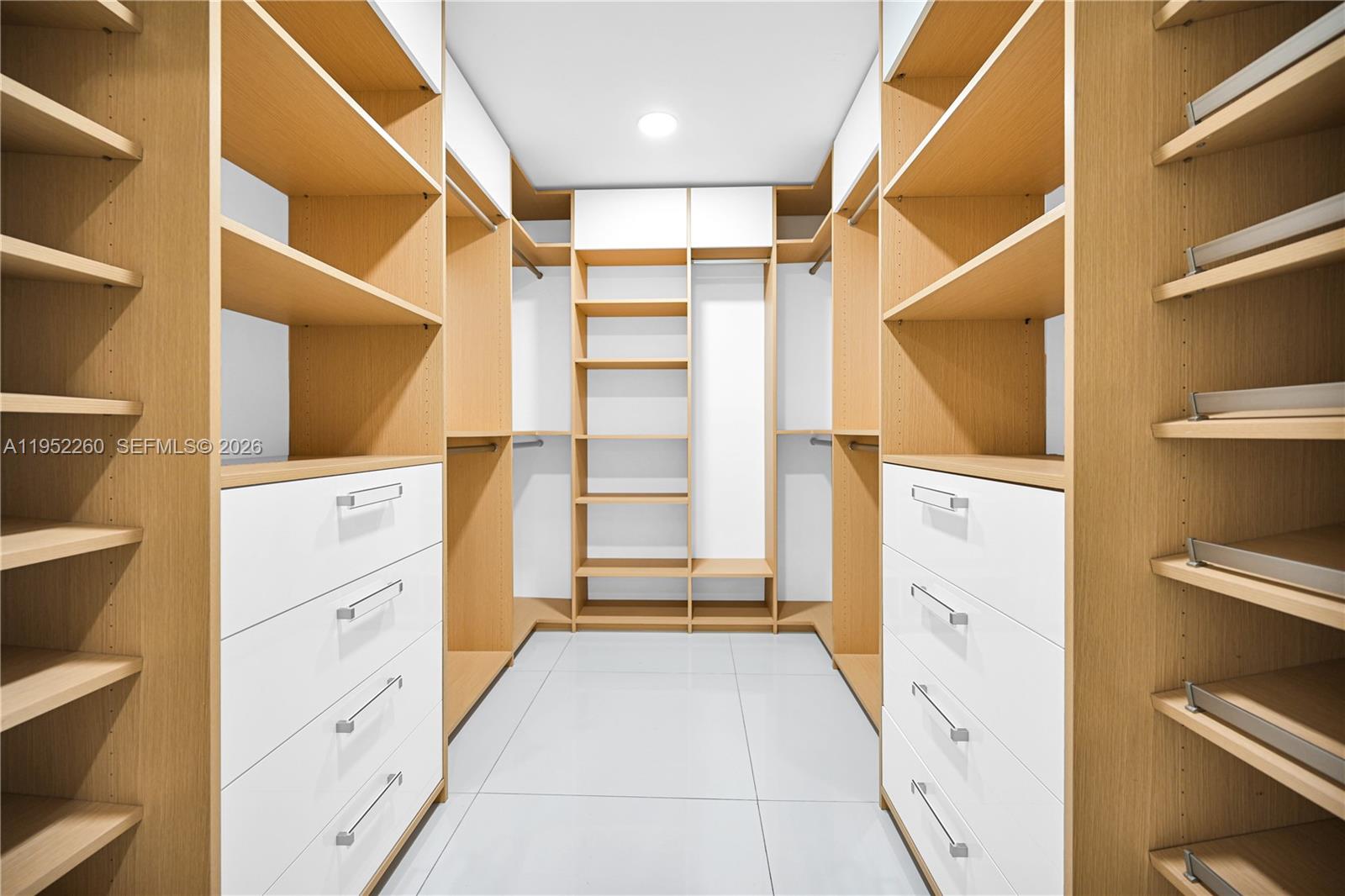 13284 Southwest 39th Street Miami, FL 33175 - Photo 25 of 67 a view of walk in closet with empty racks