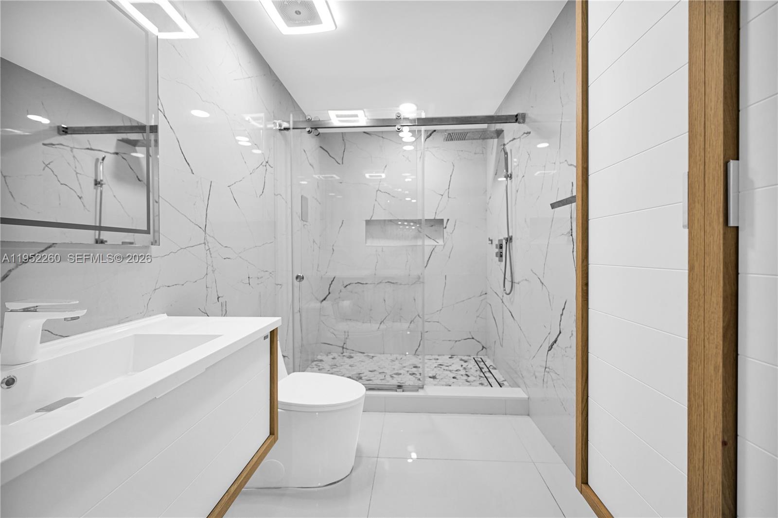 13284 Southwest 39th Street Miami, FL 33175 - Photo 26 of 67 a bathroom with a sink a toilet and shower