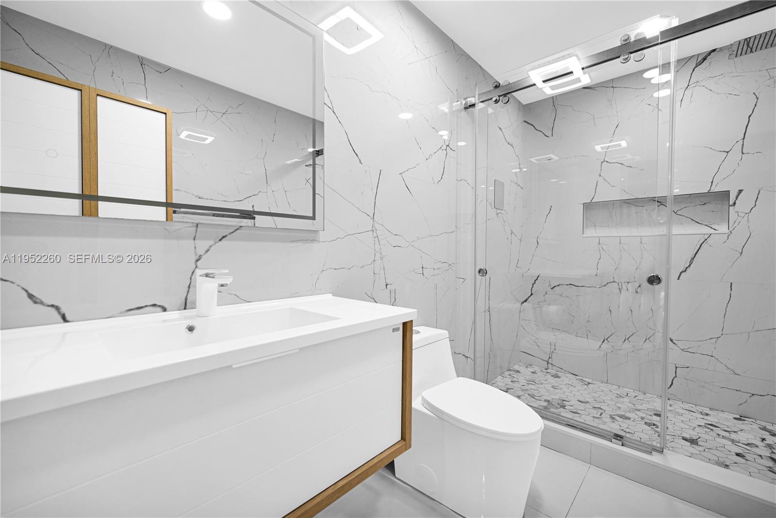 13284 Southwest 39th Street Miami, FL 33175 - Photo 27 of 67 a bathroom with a sink a toilet and shower