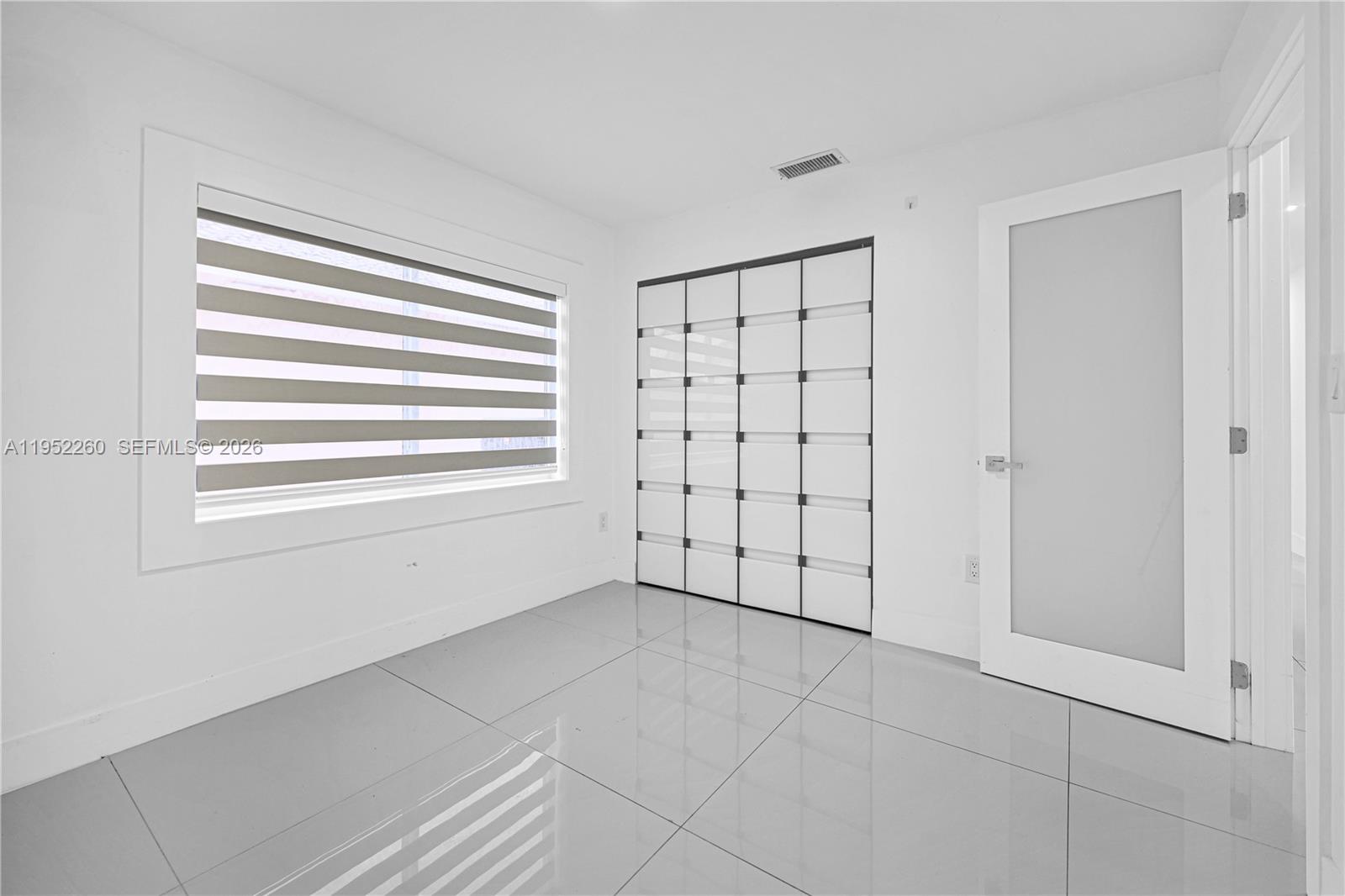 13284 Southwest 39th Street Miami, FL 33175 - Photo 35 of 67 a view of an empty room with a window