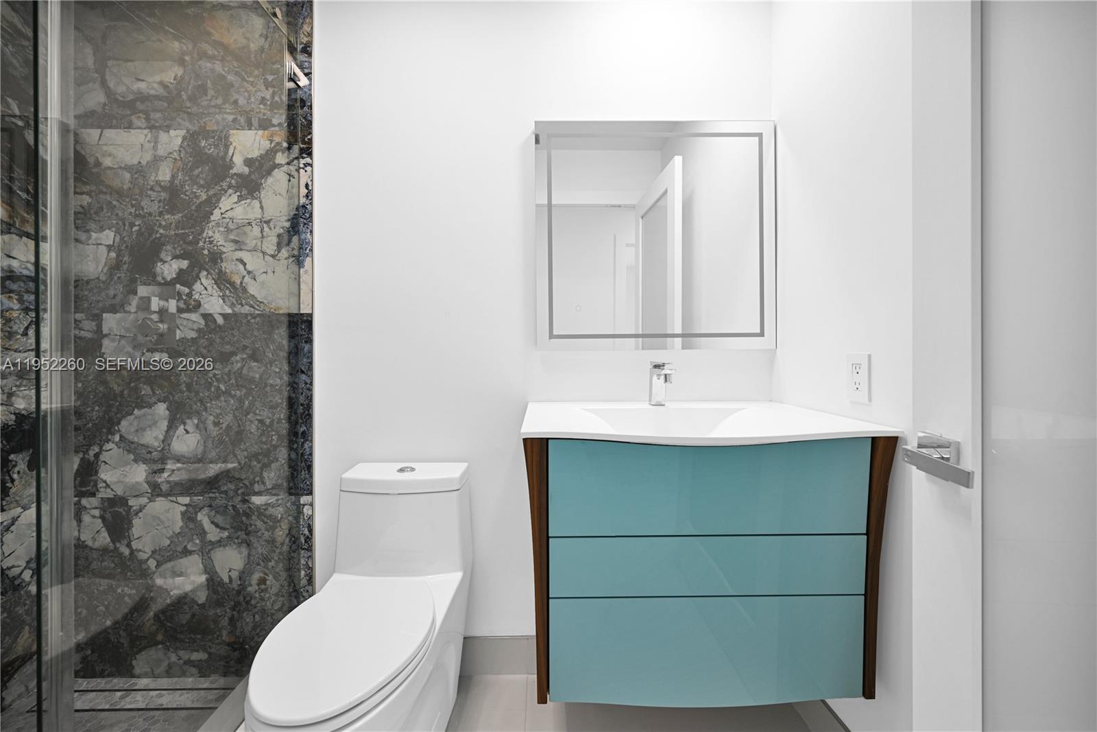 13284 Southwest 39th Street Miami, FL 33175 - Photo 42 of 67 a bathroom with a sink a toilet and shower