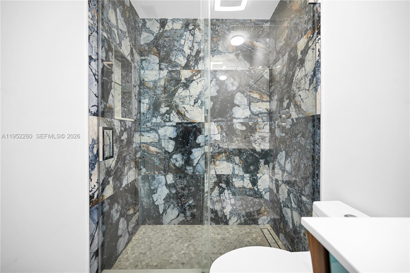 13284 Southwest 39th Street Miami, FL 33175 - Photo 43 of 67 a bathroom with a toilet and a shower curtain