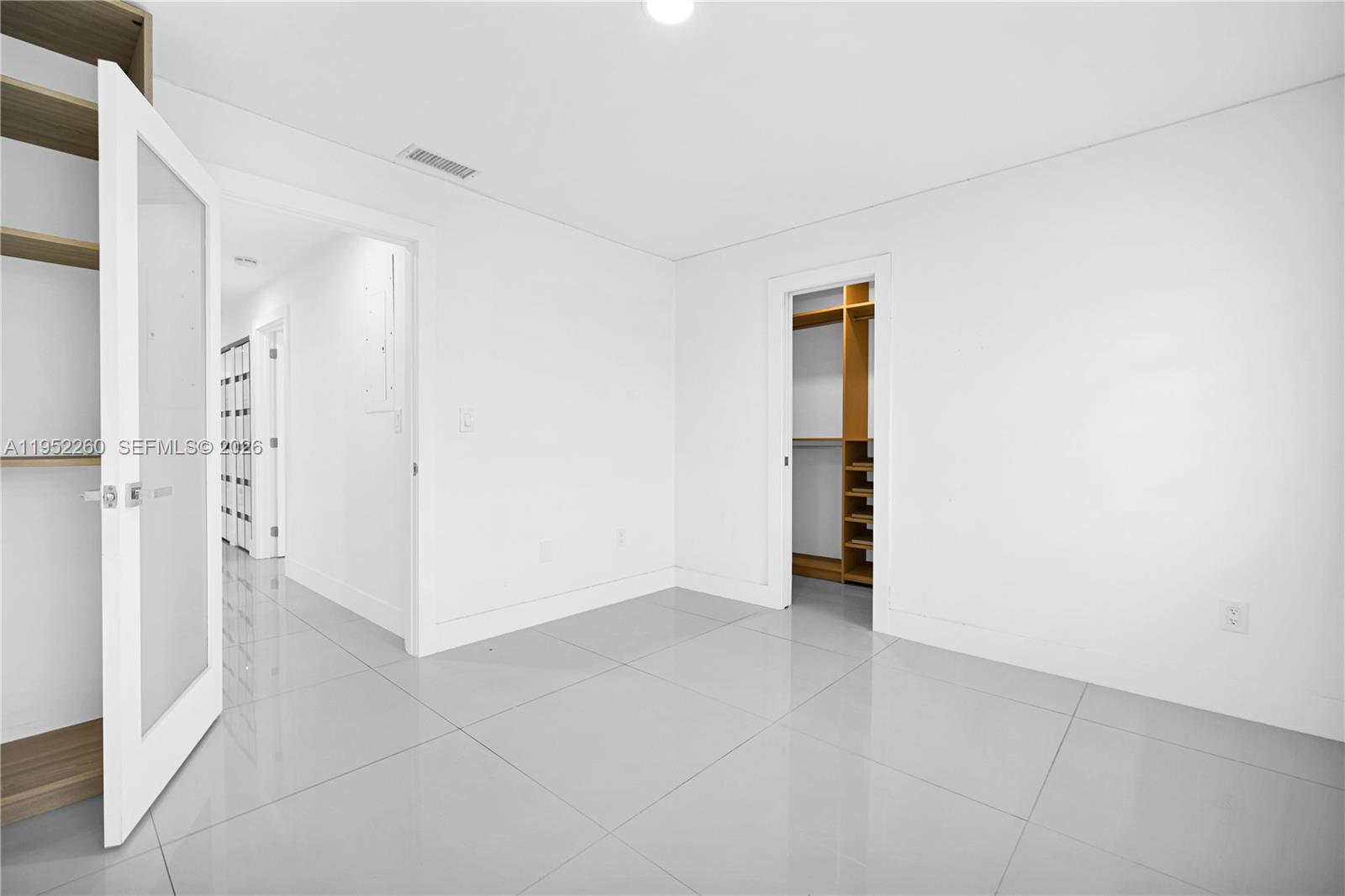 13284 Southwest 39th Street Miami, FL 33175 - Photo 47 of 67 an empty room with closet and wooden floor