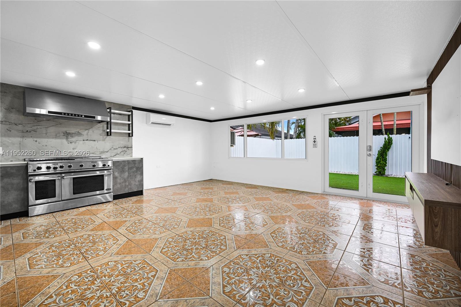 13284 Southwest 39th Street Miami, FL 33175 - Photo 48 of 67 a view of a kitchen with stainless steel appliances granite countertop a stove top oven