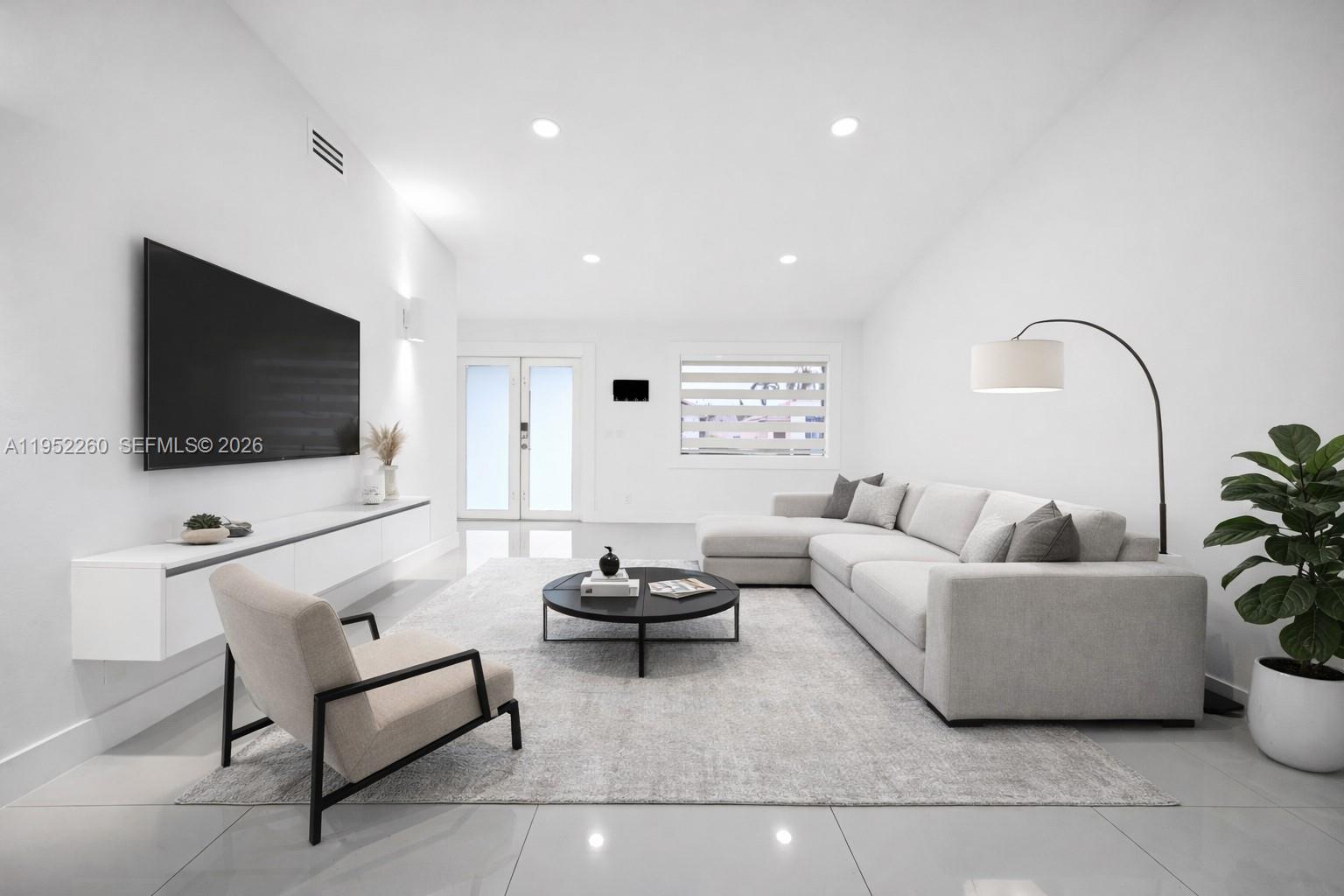 13284 Southwest 39th Street Miami, FL 33175 - Photo 5 of 67 a living room with furniture and a flat screen tv