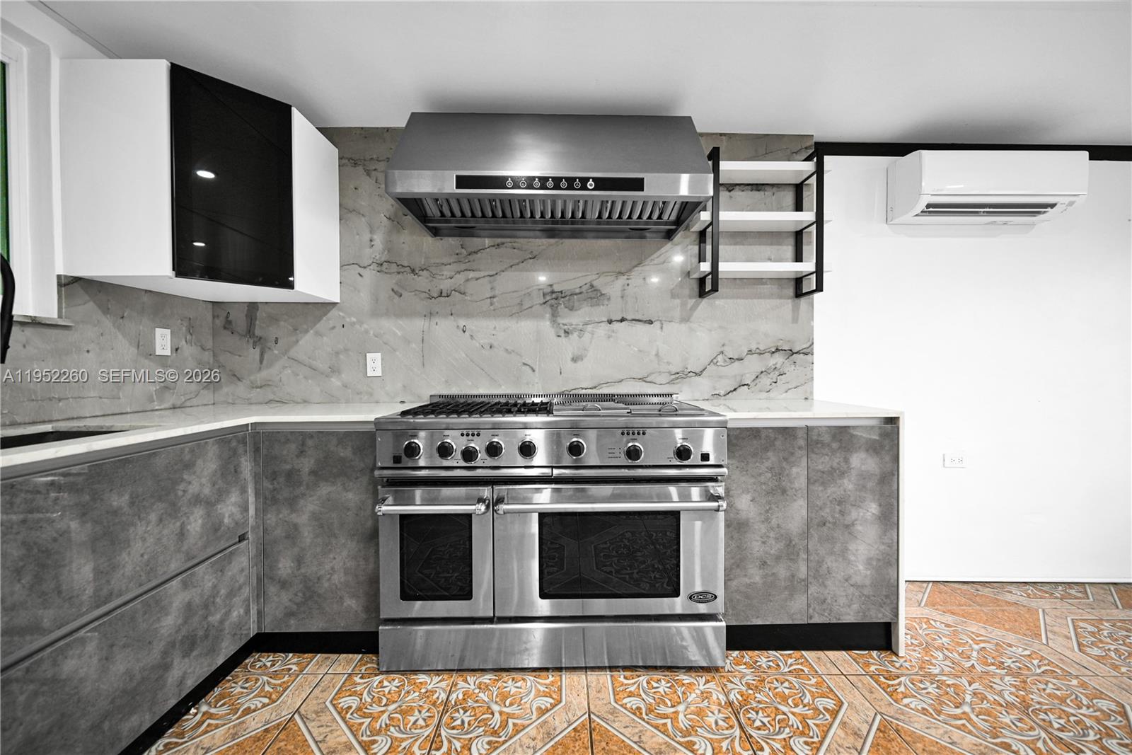 13284 Southwest 39th Street Miami, FL 33175 - Photo 52 of 67 a stove top oven sitting inside of a kitchen