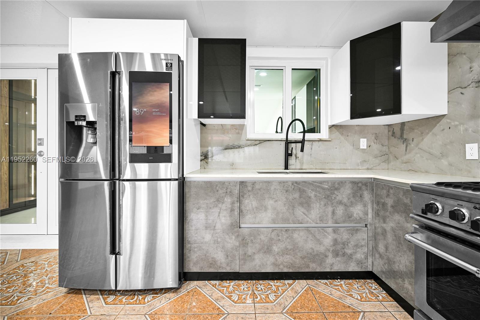 13284 Southwest 39th Street Miami, FL 33175 - Photo 53 of 67 a kitchen with a refrigerator and a sink