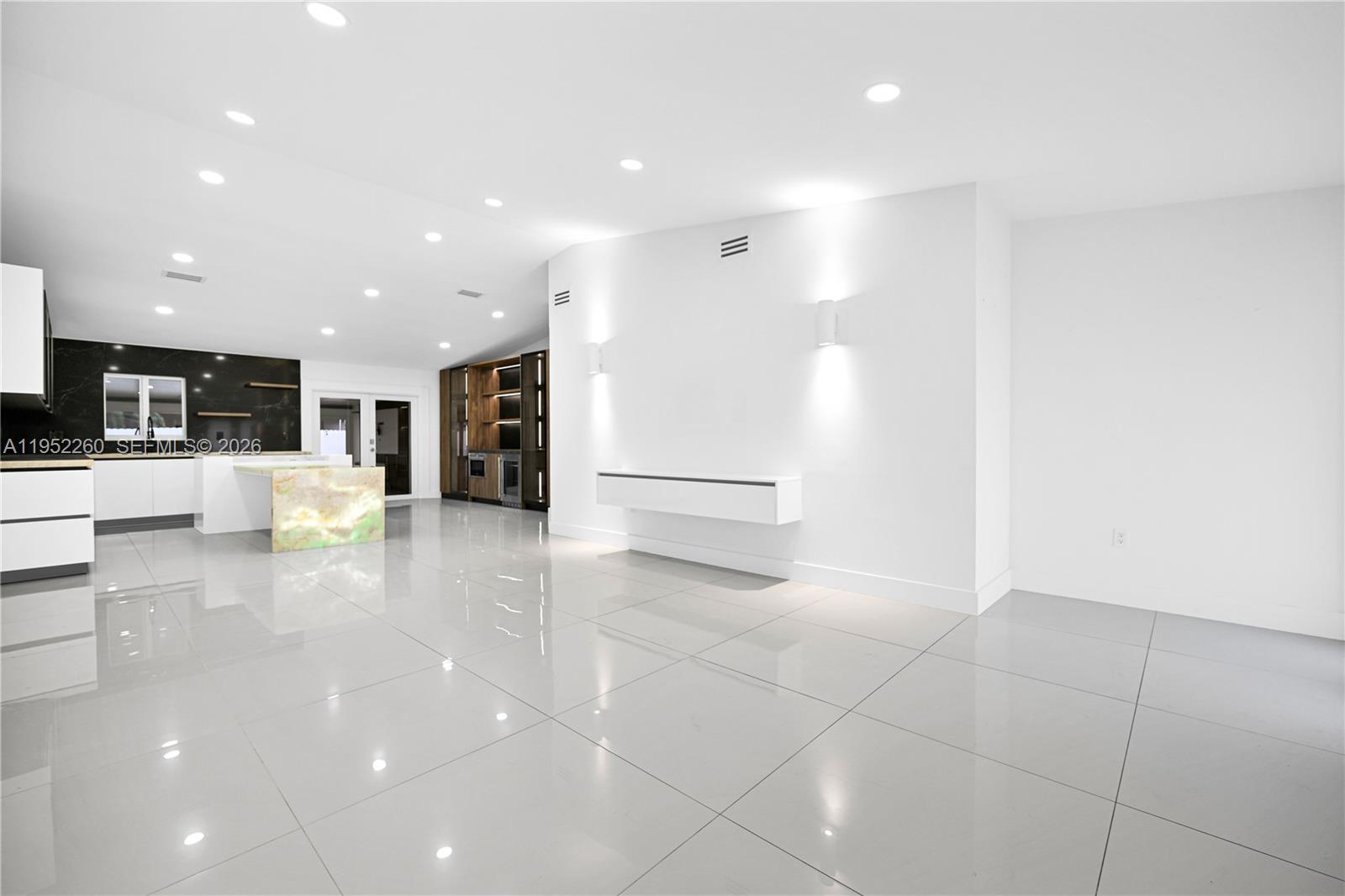 13284 Southwest 39th Street Miami, FL 33175 - Photo 9 of 67 a view of a living room kitchen with stainless steel appliances a refrigerator and counter space