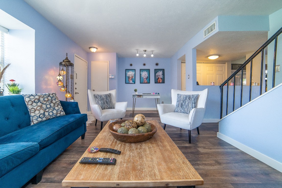 a living room with furniture and a rug