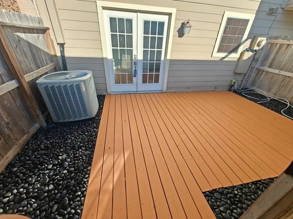 a view of outdoor space with deck and wooden floor