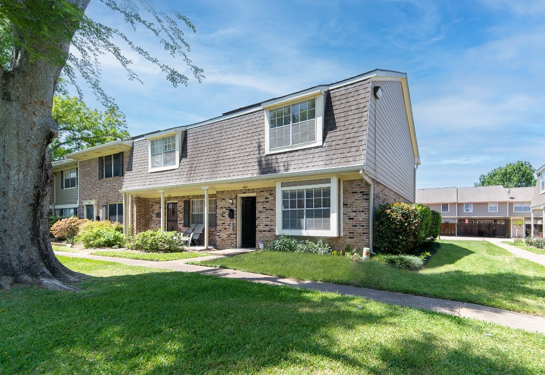 4866 Milwee Street, Unit 22 Houston, TX 77092 - Photo 20 of 23 a front view of a house with a yard