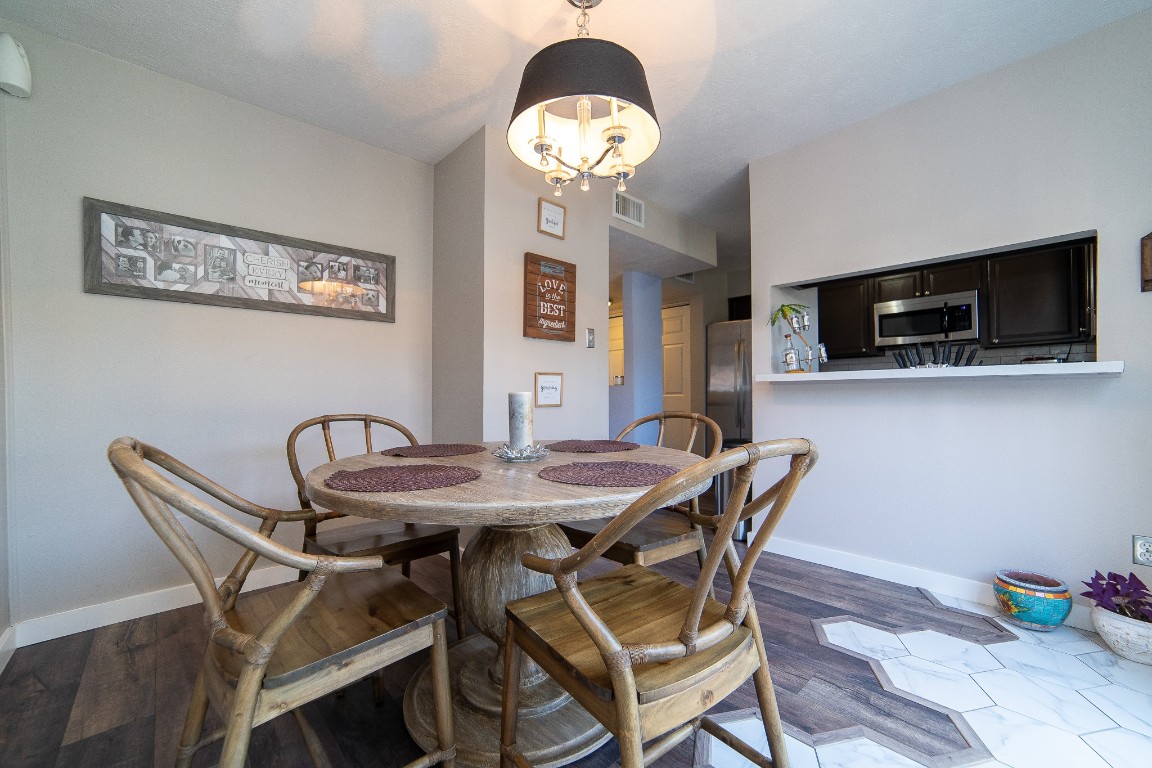4866 Milwee Street, Unit 22 Houston, TX 77092 - Photo 6 of 23 a dining room with furniture and window