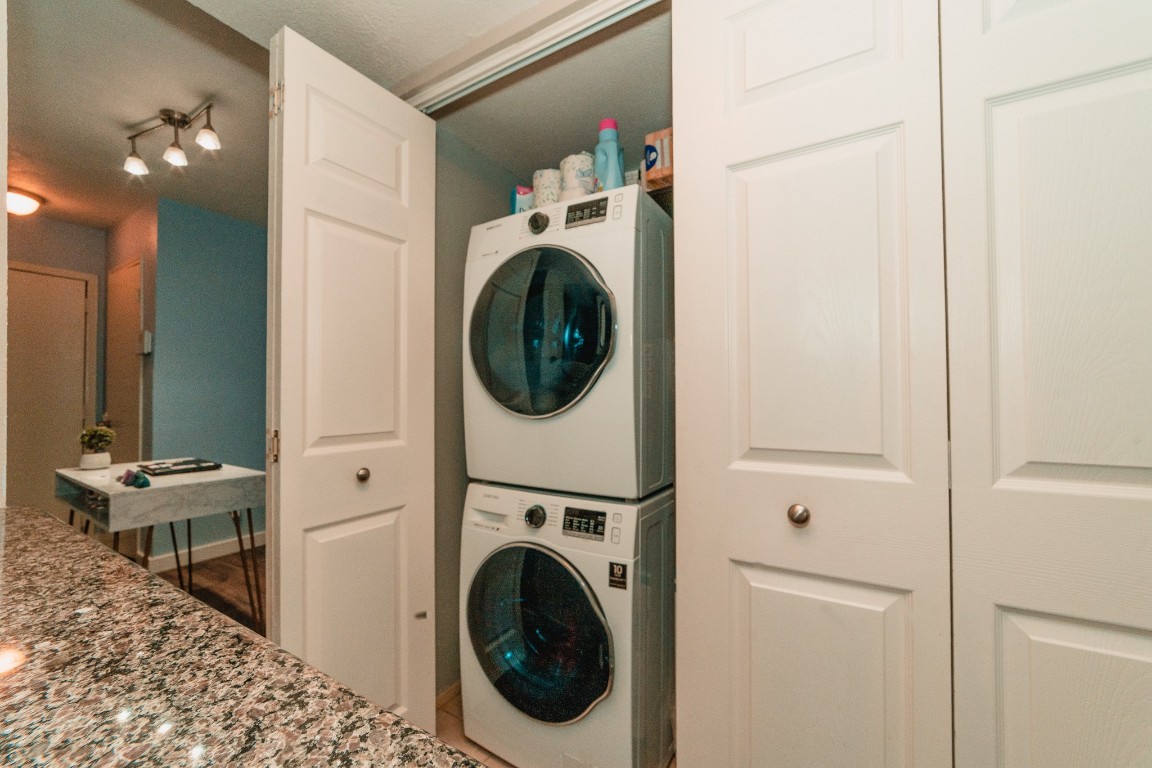 4866 Milwee Street, Unit 22 Houston, TX 77092 - Photo 7 of 23 a view of a hallway with washer and dryer