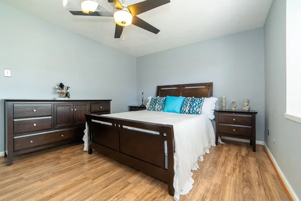 a bedroom with a bed and a dresser