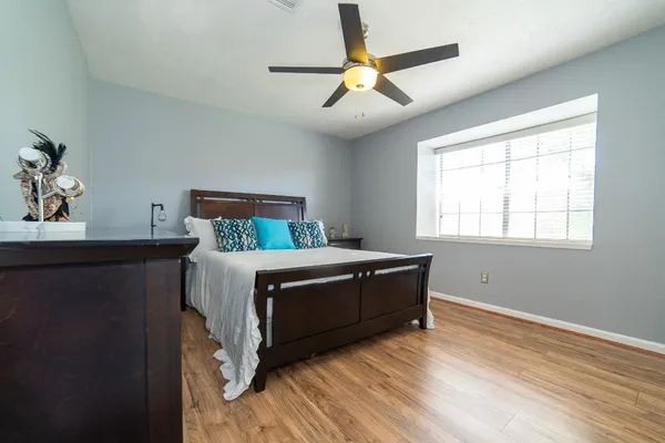 a bedroom with a bed and a window