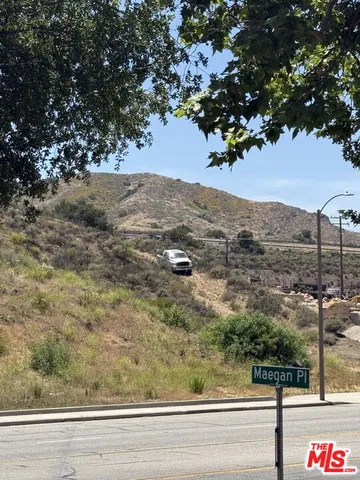 a car parked in the middle of a field