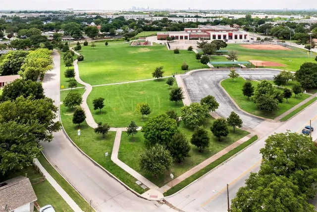 a view of a chair and table in the garden
