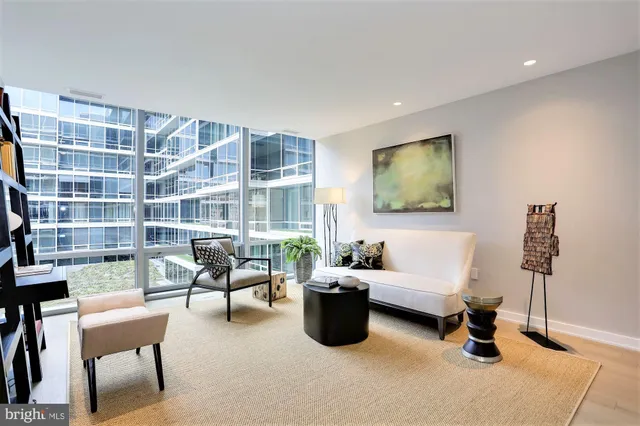 a living room with furniture and a lamp
