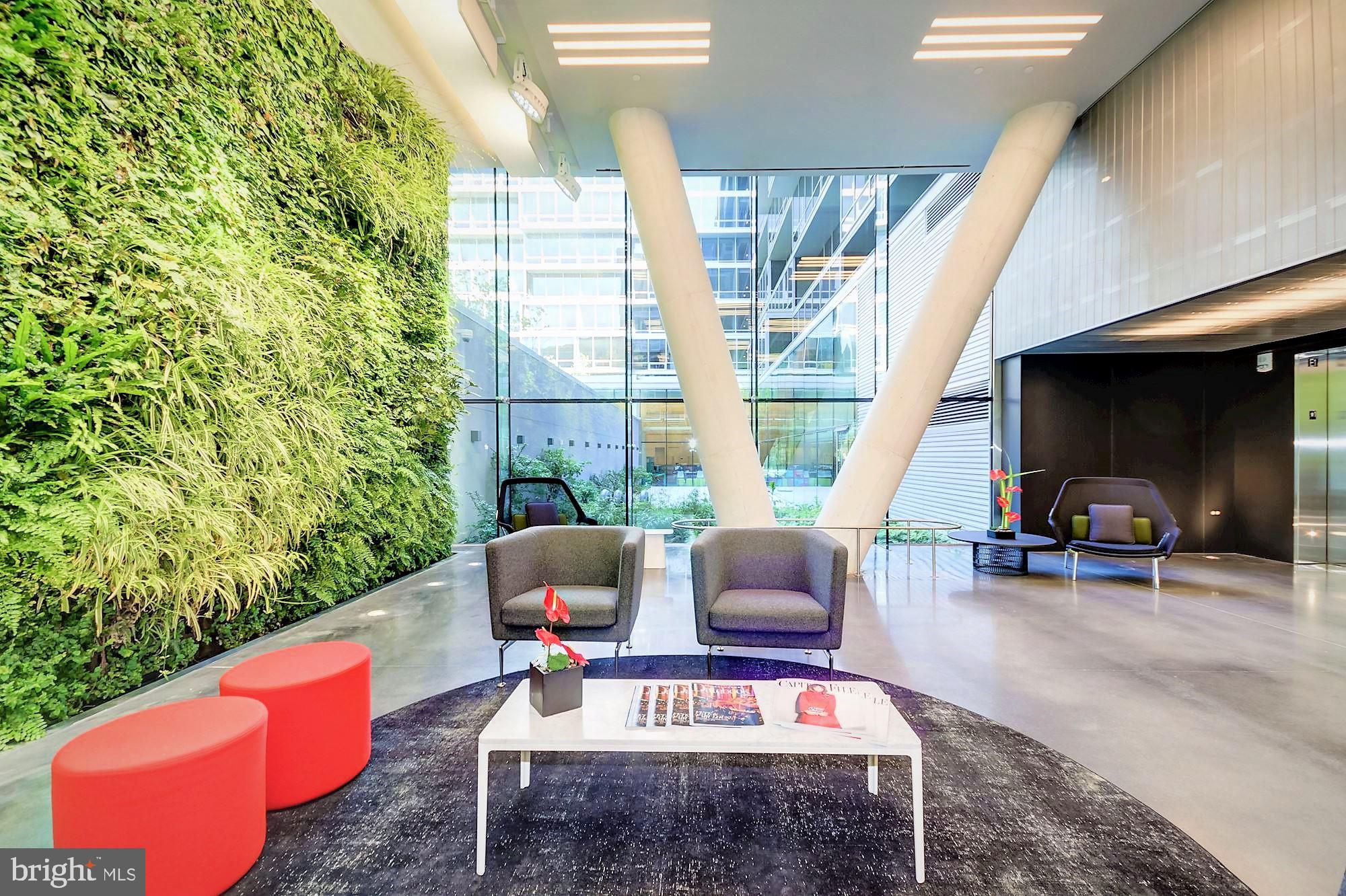 1111 24th Street Northwest, Unit 81 Washington, DC 20037 - Photo 15 of 19 a outdoor living space with furniture a rug and a window