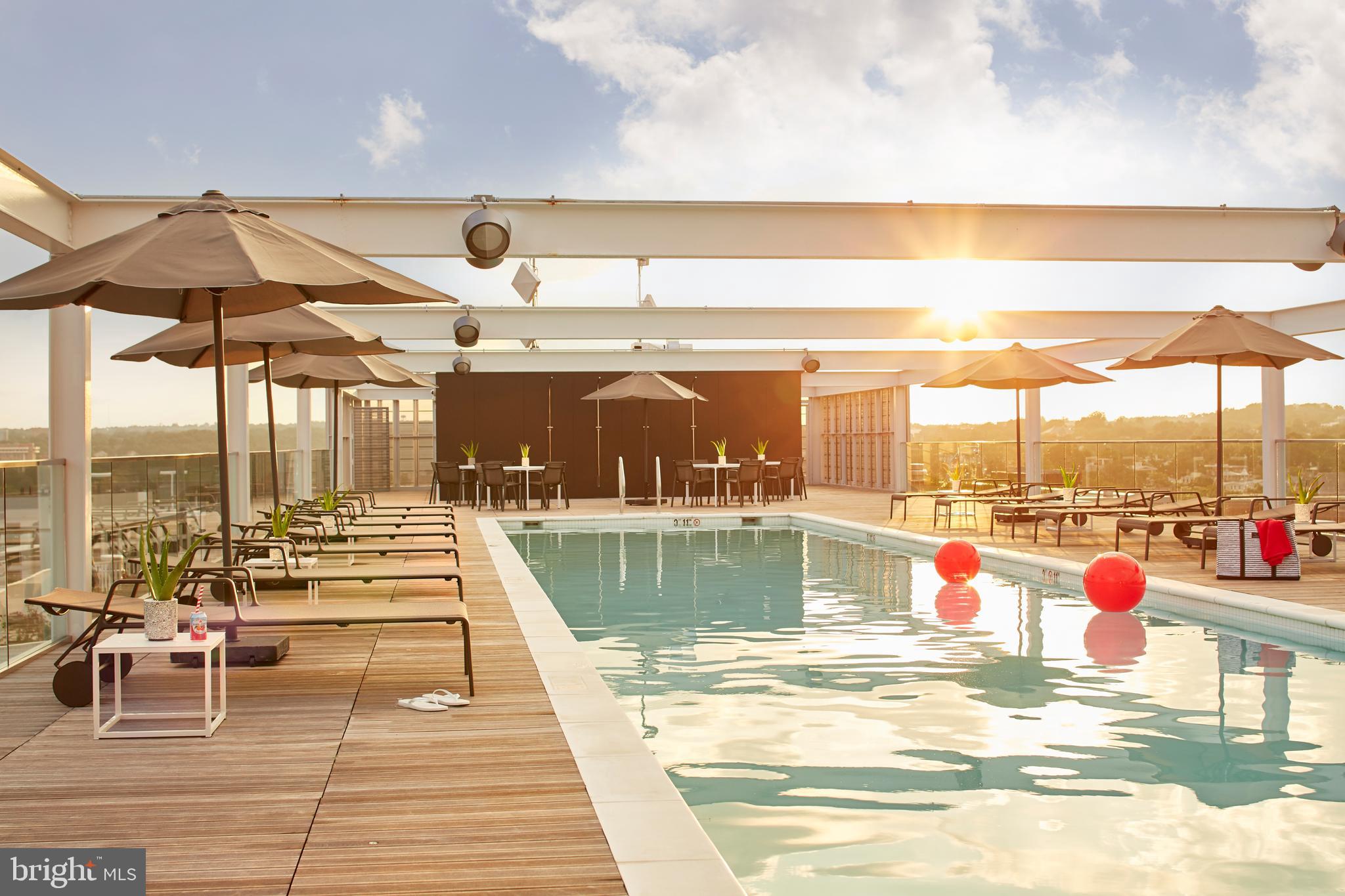 1111 24th Street Northwest, Unit 81 Washington, DC 20037 - Photo 16 of 19 a view of a swimming pool with a lounge chairs