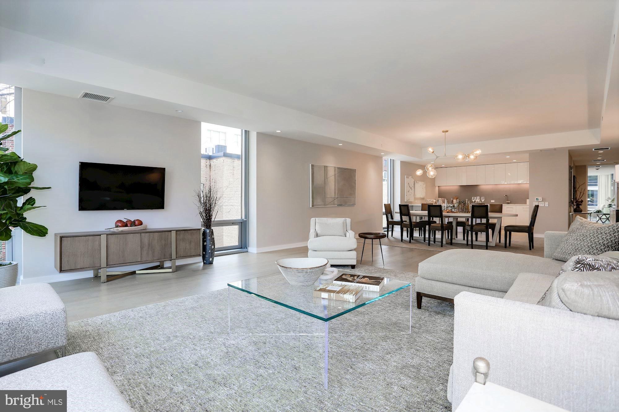 1111 24th Street Northwest, Unit 81 Washington, DC 20037 - Photo 2 of 19 a living room with furniture and a flat screen tv