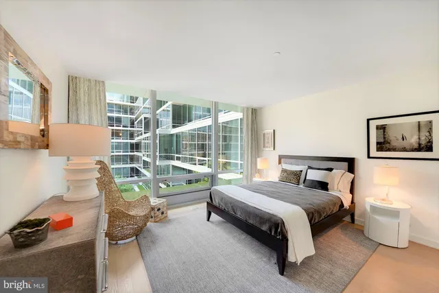 a bedroom with a bed and a couch