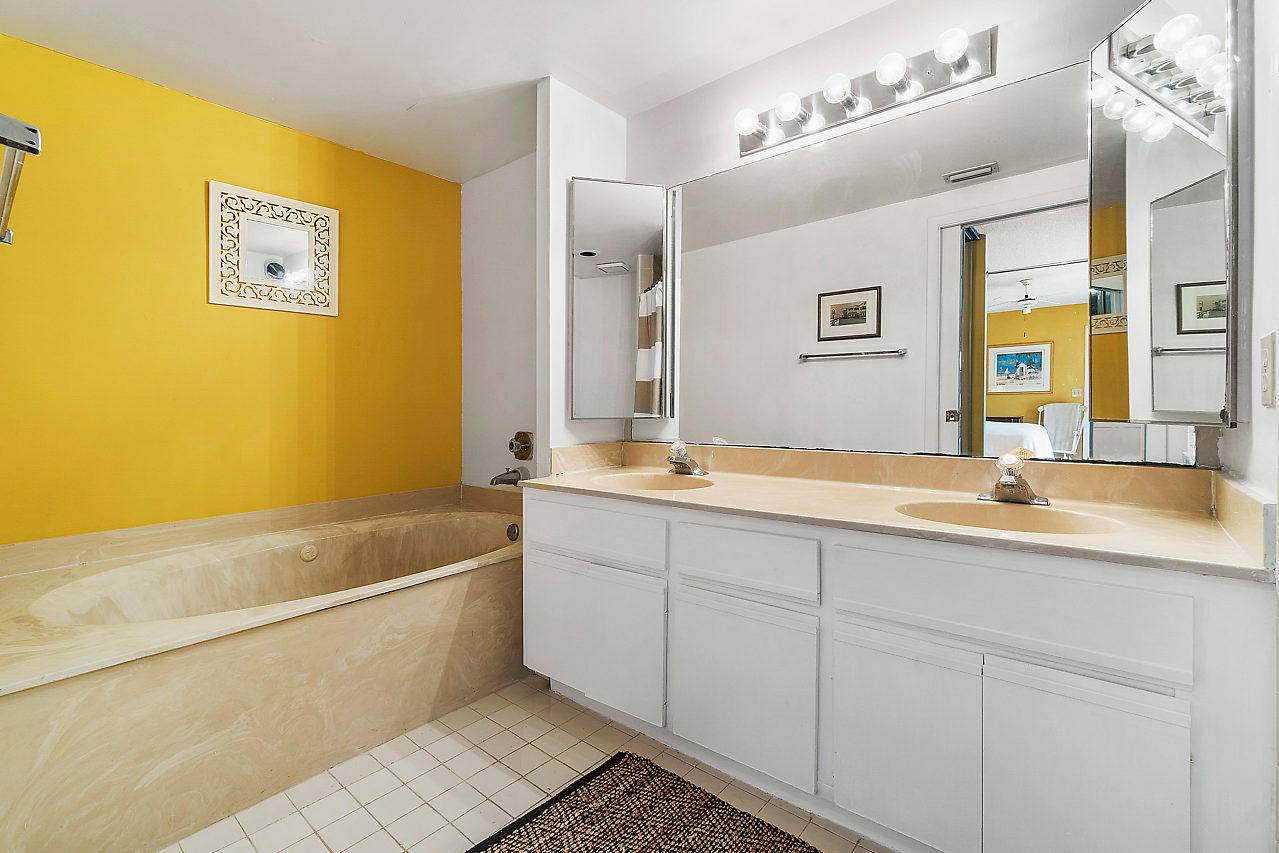8481 Boca Rio Drive Boca Raton, FL 33433 - Photo 18 of 27 a bathroom with a tub sink and mirror