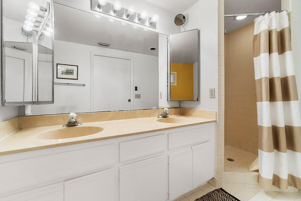 8481 Boca Rio Drive Boca Raton, FL 33433 - Photo 20 of 27 a bathroom with a sink and a mirror