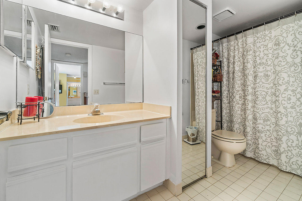 8481 Boca Rio Drive Boca Raton, FL 33433 - Photo 24 of 27 a bathroom with a sink toilet and shower