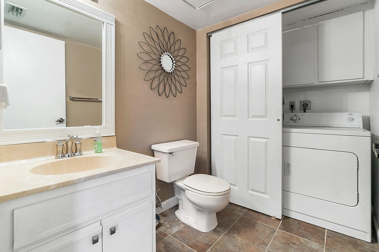 8481 Boca Rio Drive Boca Raton, FL 33433 - Photo 9 of 27 a bathroom with a sink a toilet and vanity