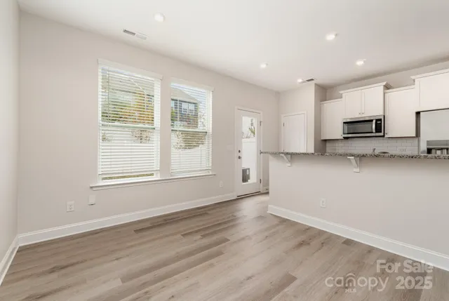 a view of a kitchen with a sink and a stove top oven