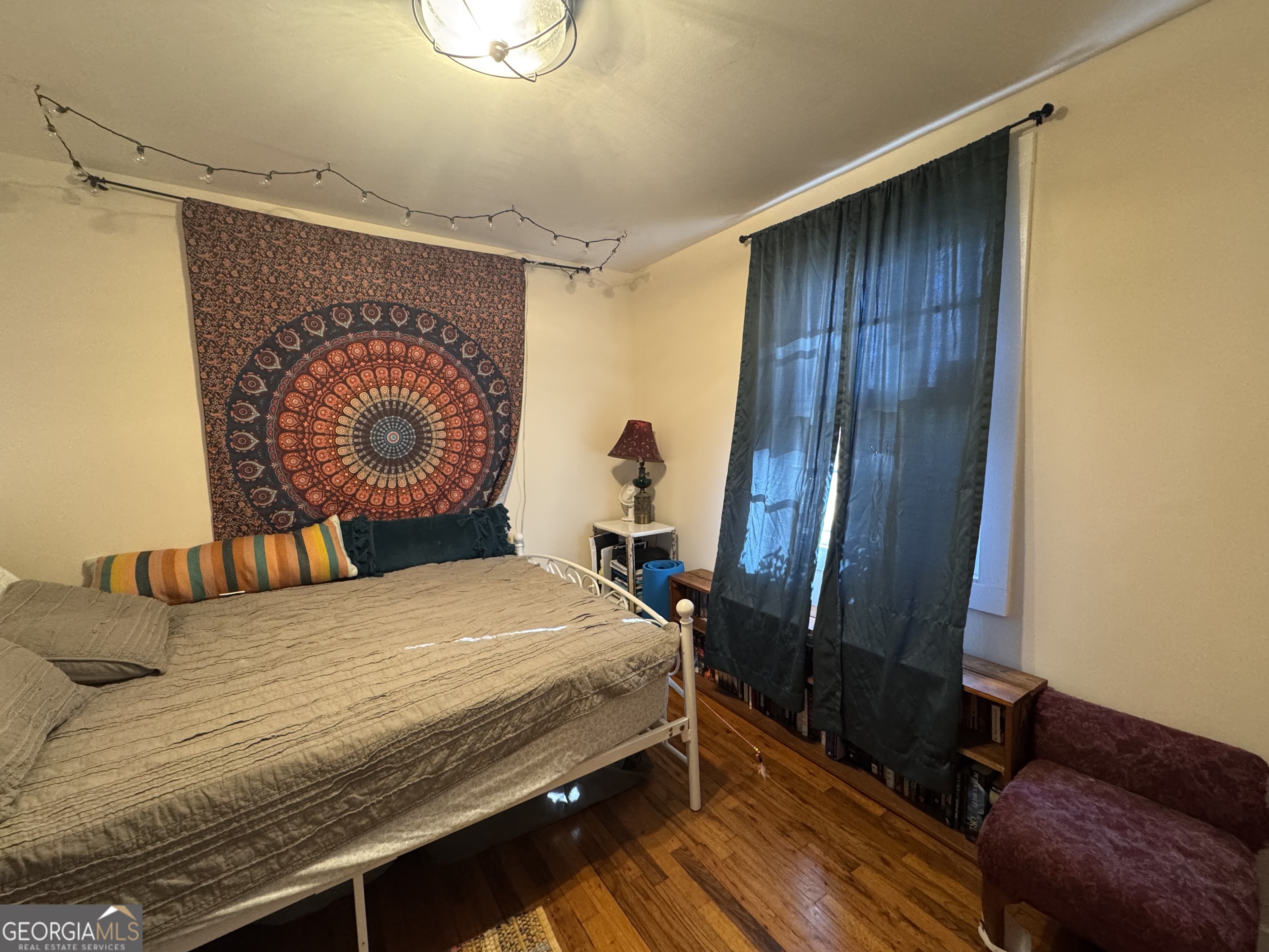 569 Farmers High Road Carrollton, GA 30117 - Photo 11 of 11 a bedroom with a bed and a dresser