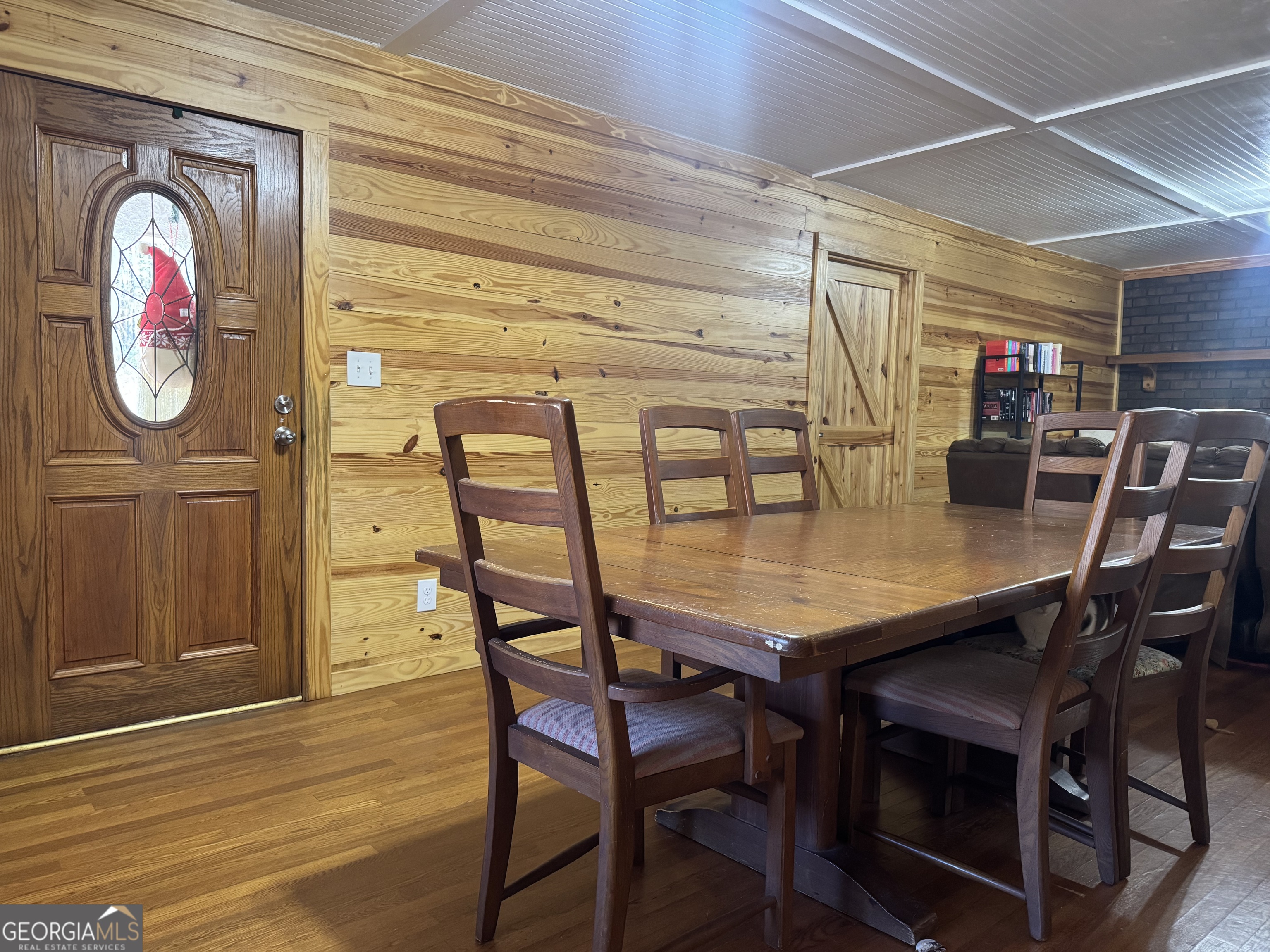 569 Farmers High Road Carrollton, GA 30117 - Photo 4 of 11 a dining room with furniture and wooden floor