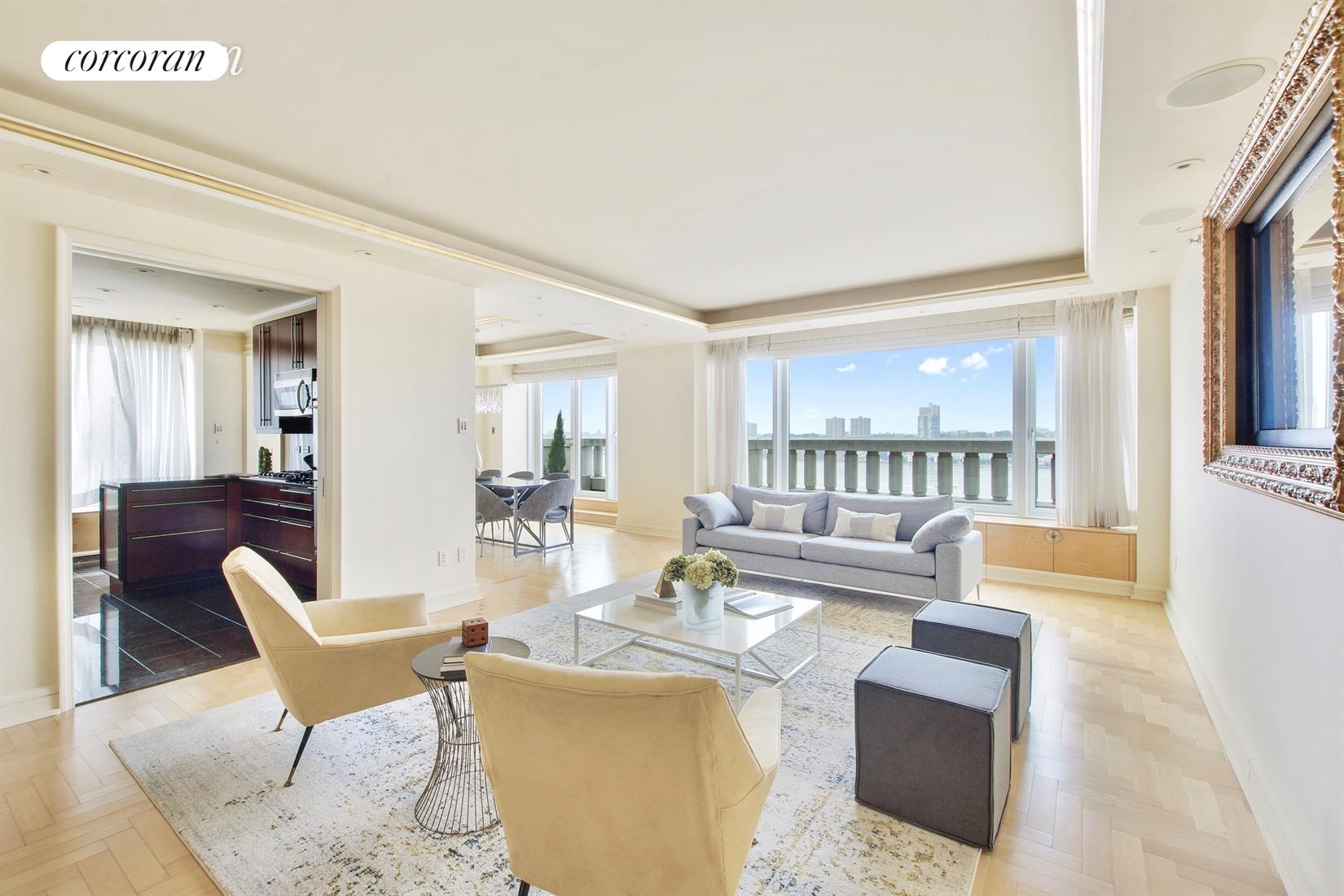 240 Riverside Boulevard, Unit 12E Manhattan, NY 10069 - Photo 1 of 1 a living room with fireplace furniture and a wooden floor