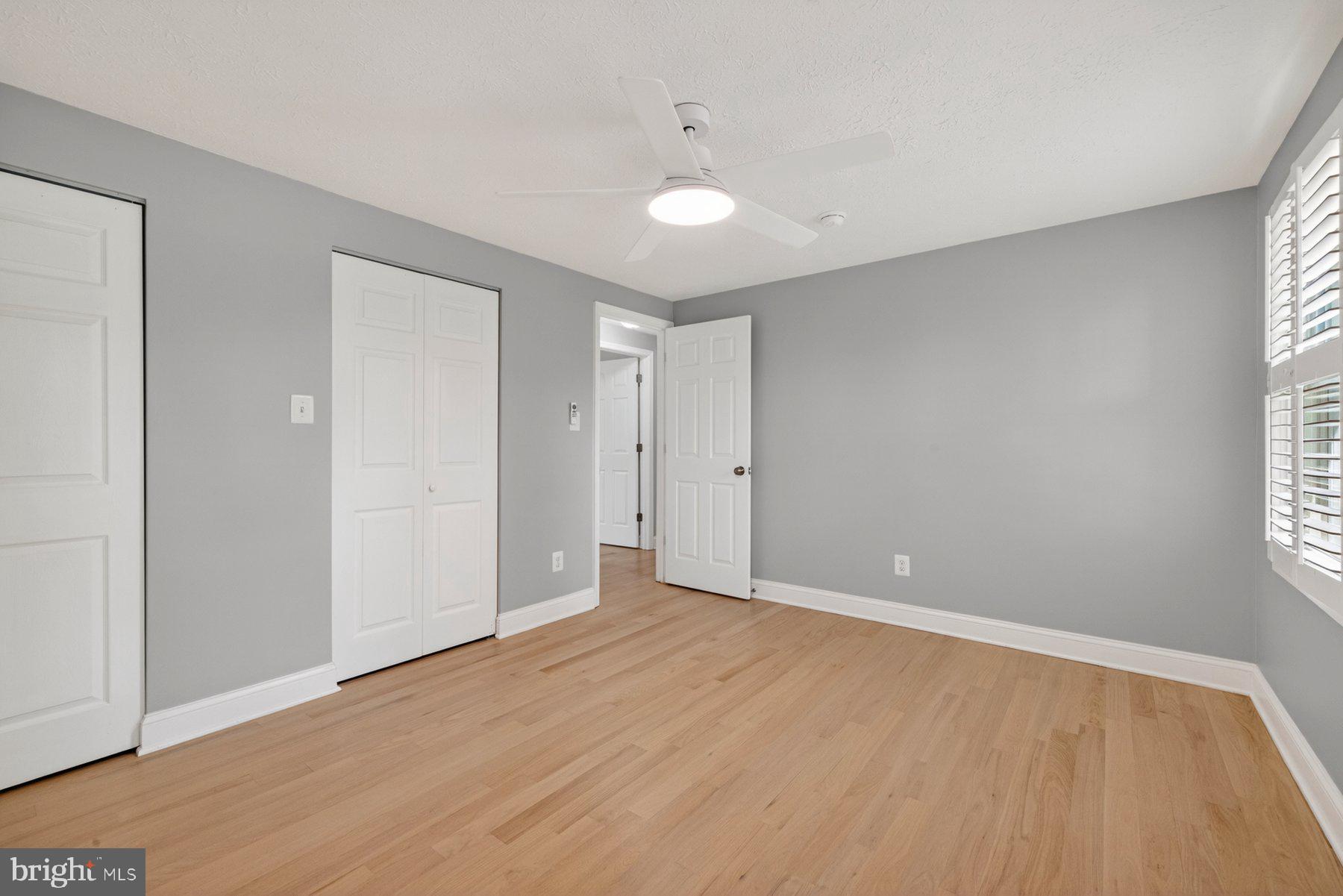 7518 Candytuft Court Springfield, VA 22153 - Photo 26 of 47 a view of an empty room with wooden floor and a window