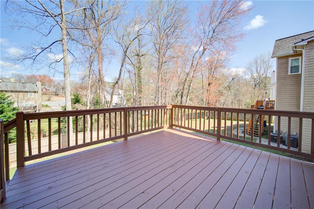 745 Welford Road Northwest Suwanee, GA 30024 - Photo 29 of 32 a view of balcony with wooden floor