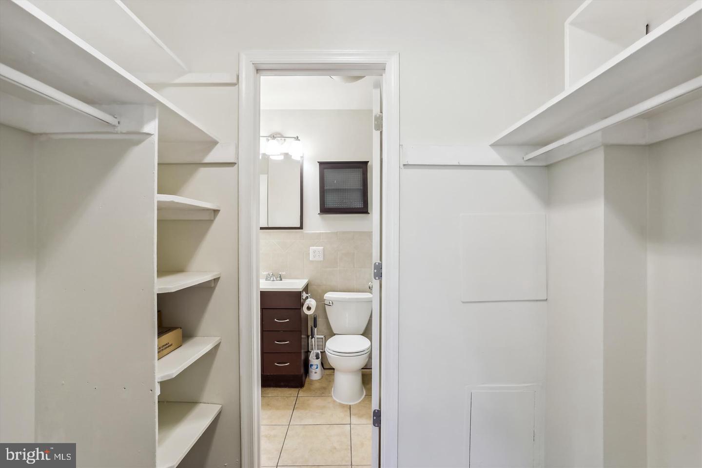 1900 Lyttonsville Road, Unit 602 Silver Spring, MD 20910 - Photo 19 of 43 a bathroom with a toilet and a shower