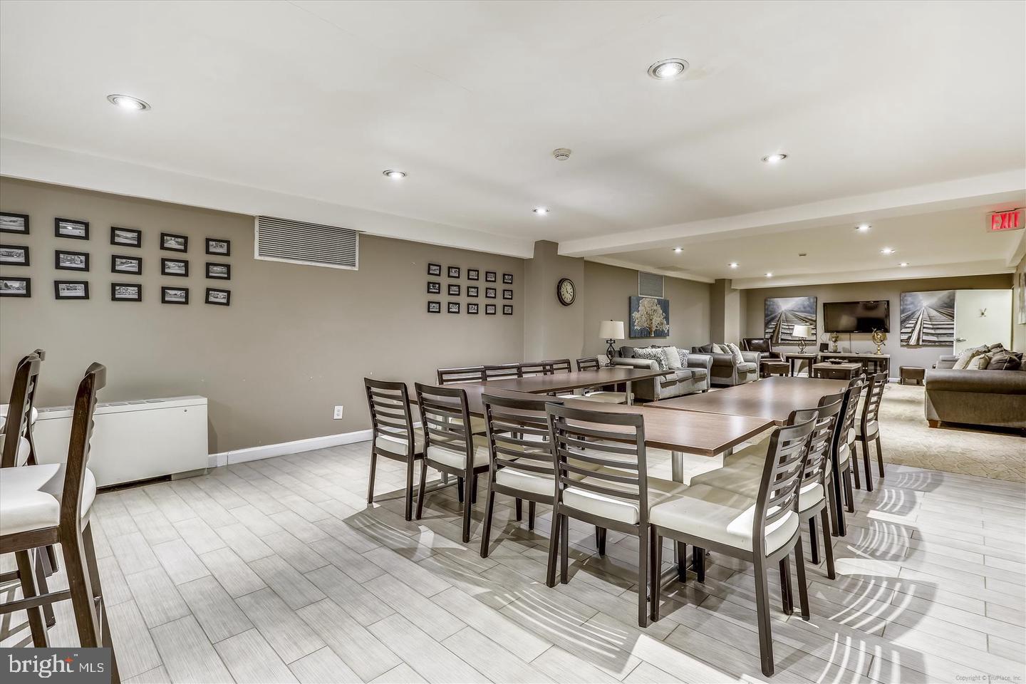 1900 Lyttonsville Road, Unit 602 Silver Spring, MD 20910 - Photo 30 of 43 a view of a dining area with furniture and wooden floor