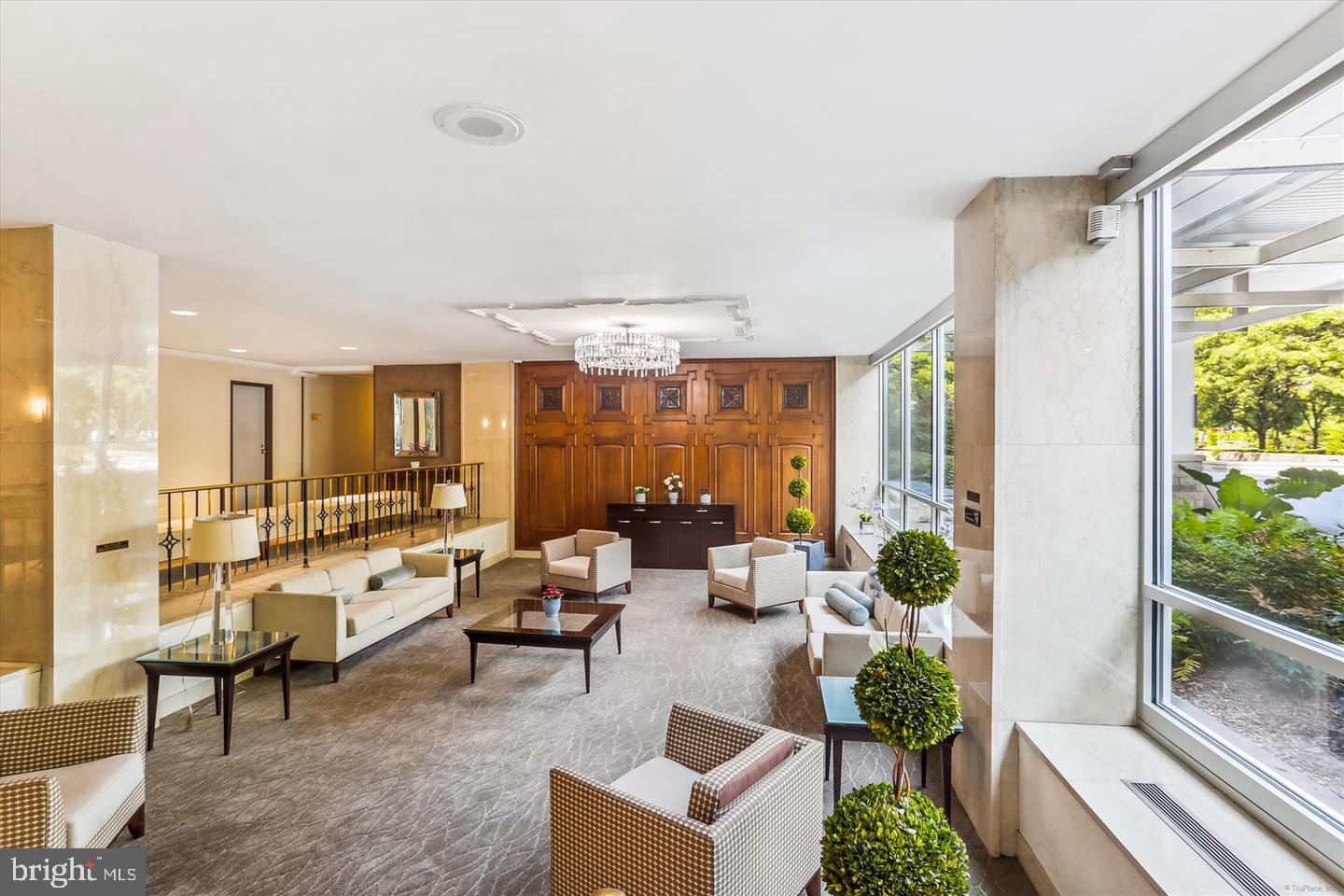 1900 Lyttonsville Road, Unit 602 Silver Spring, MD 20910 - Photo 34 of 43 a living room with furniture and a large window