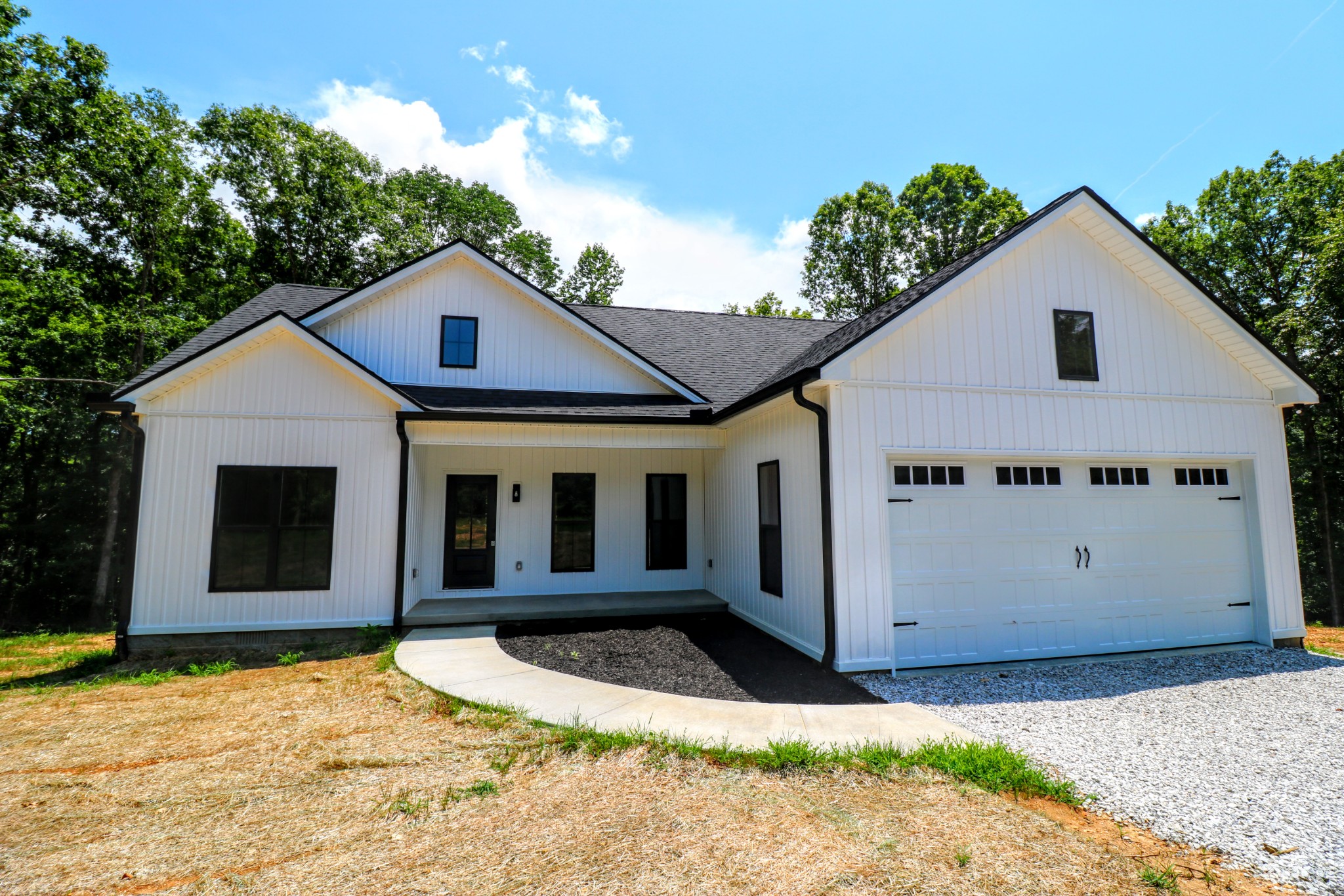 2775 Mayne Trace Road Waverly, TN 37185 - Photo 2 of 43 a view of a white house with a yard and potted plants