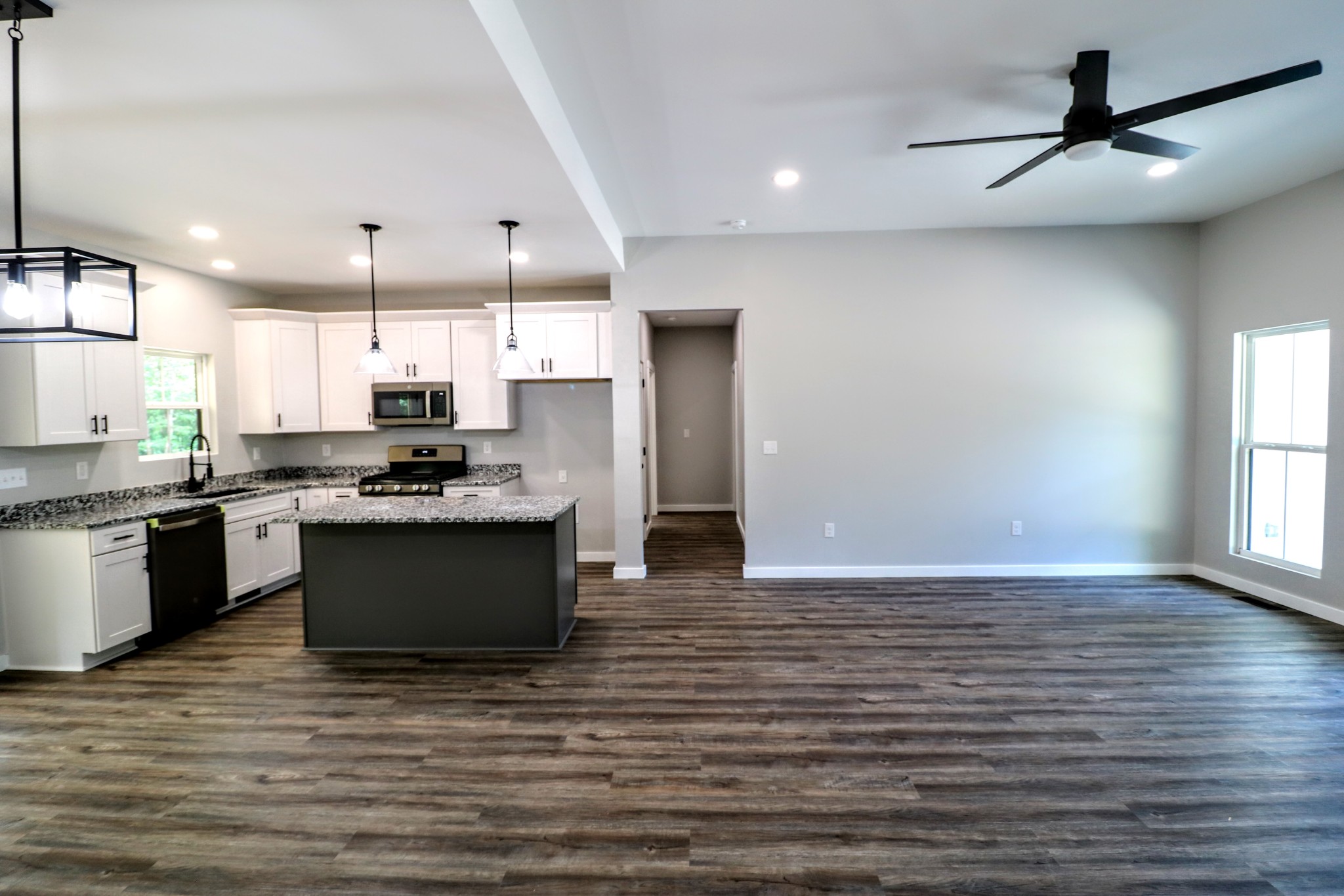 2775 Mayne Trace Road Waverly, TN 37185 - Photo 21 of 43 a kitchen with kitchen island a sink stainless steel appliances and cabinets