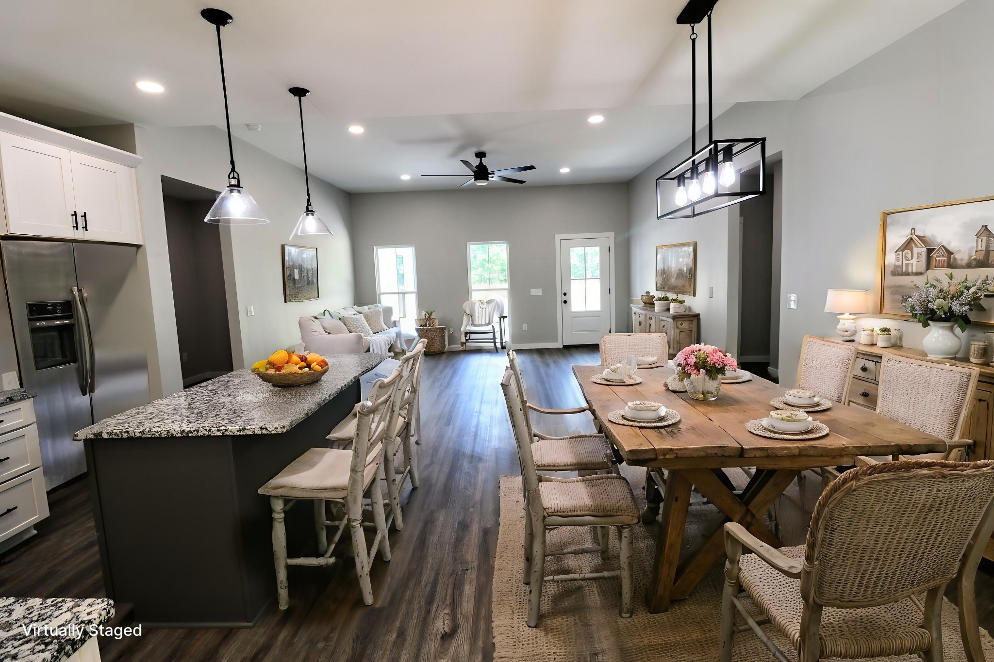 2775 Mayne Trace Road Waverly, TN 37185 - Photo 23 of 43 a view of a dining room and livingroom with furniture wooden floor a chandelier