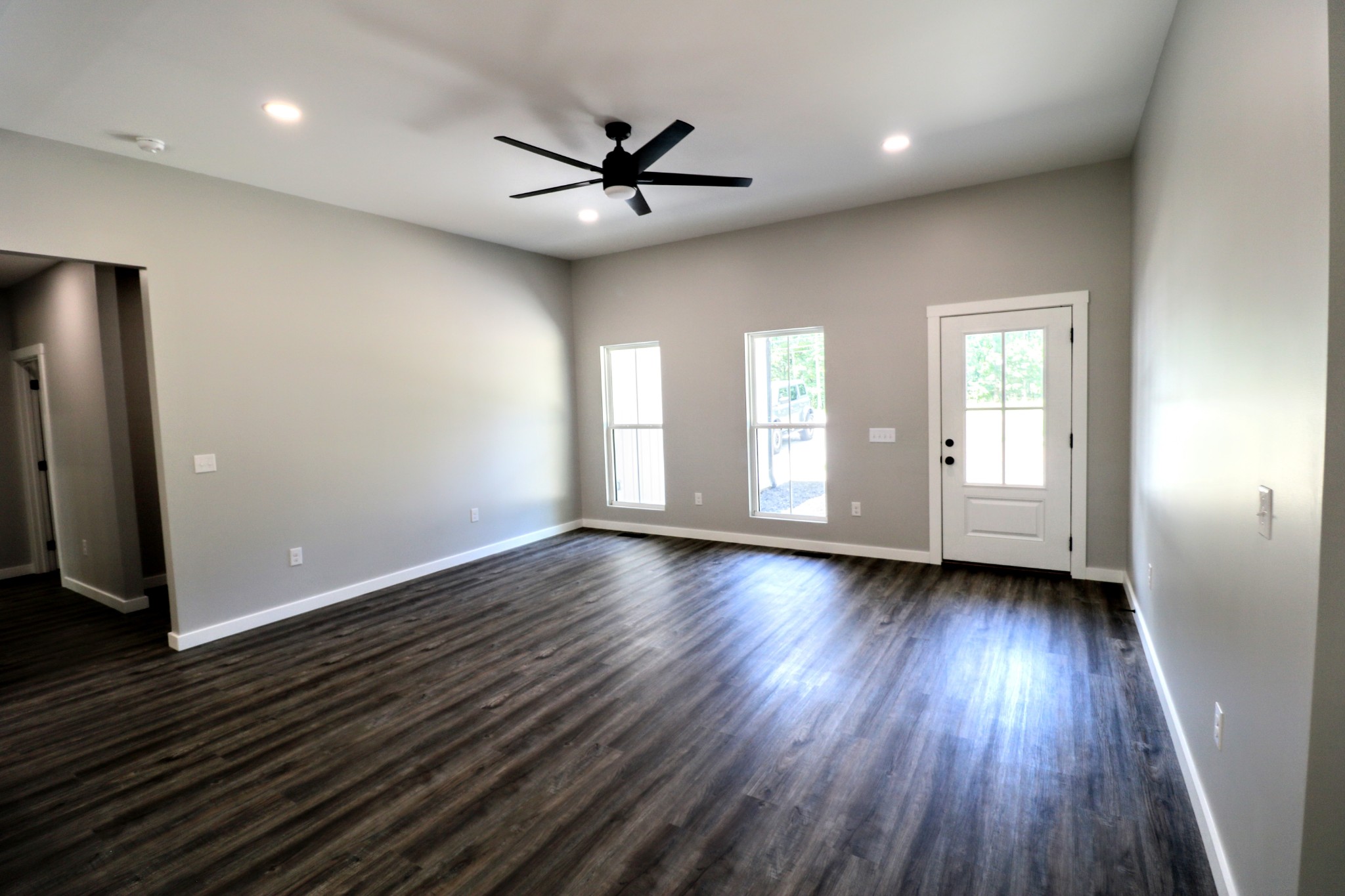 2775 Mayne Trace Road Waverly, TN 37185 - Photo 24 of 43 a view of an empty room with wooden floor and a window