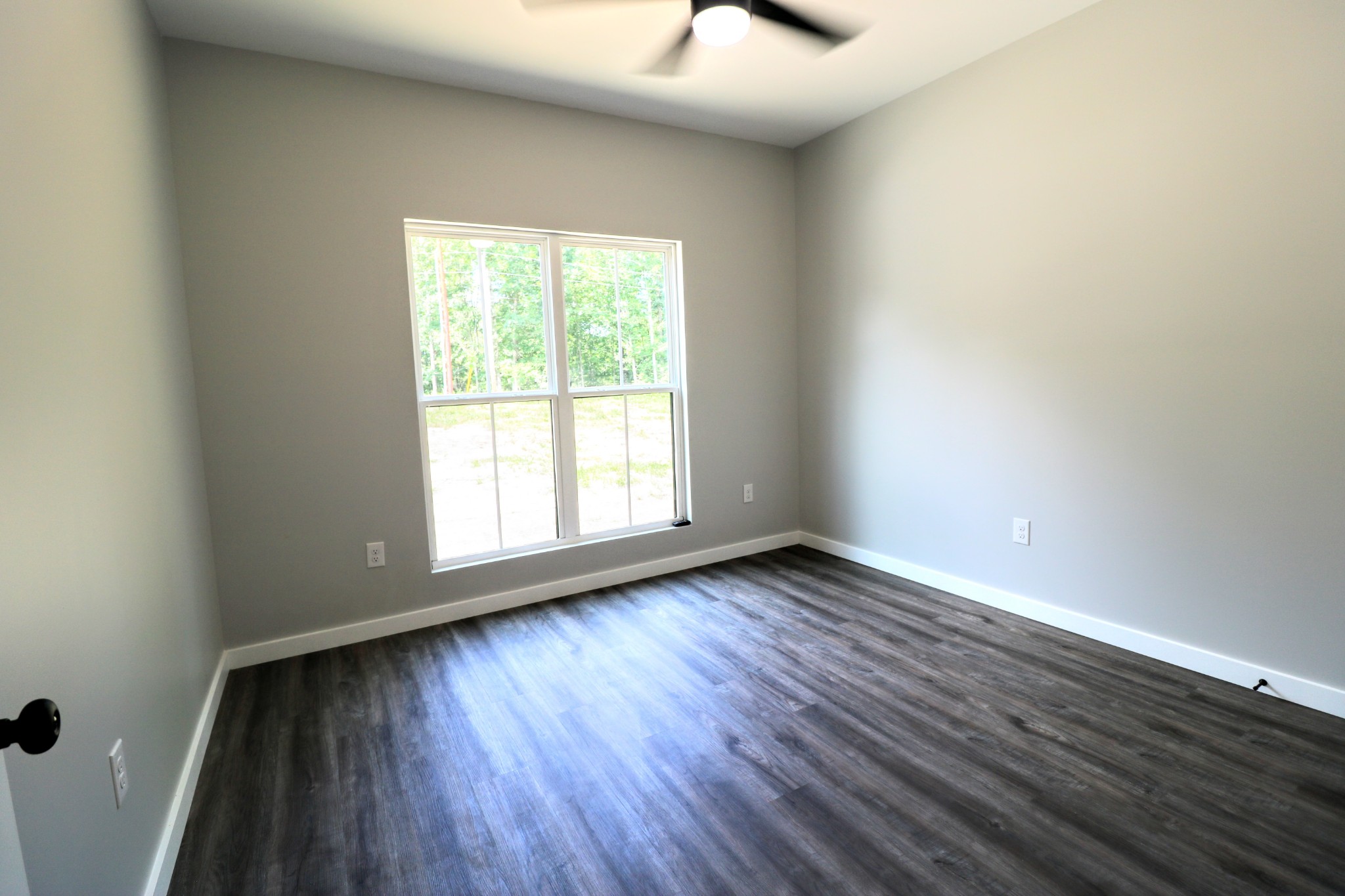 2775 Mayne Trace Road Waverly, TN 37185 - Photo 37 of 43 a view of an empty room with wooden floor and a window