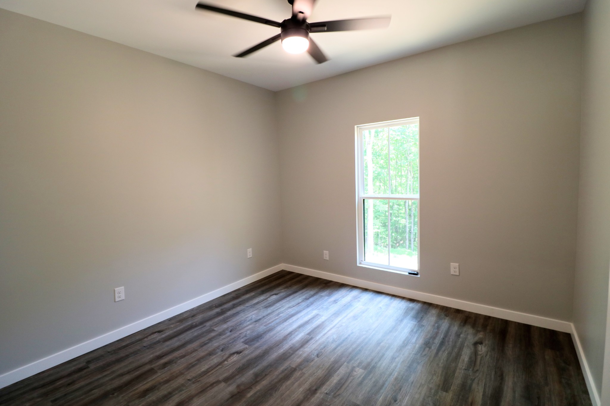 2775 Mayne Trace Road Waverly, TN 37185 - Photo 38 of 43 wooden floor in an empty room with a window