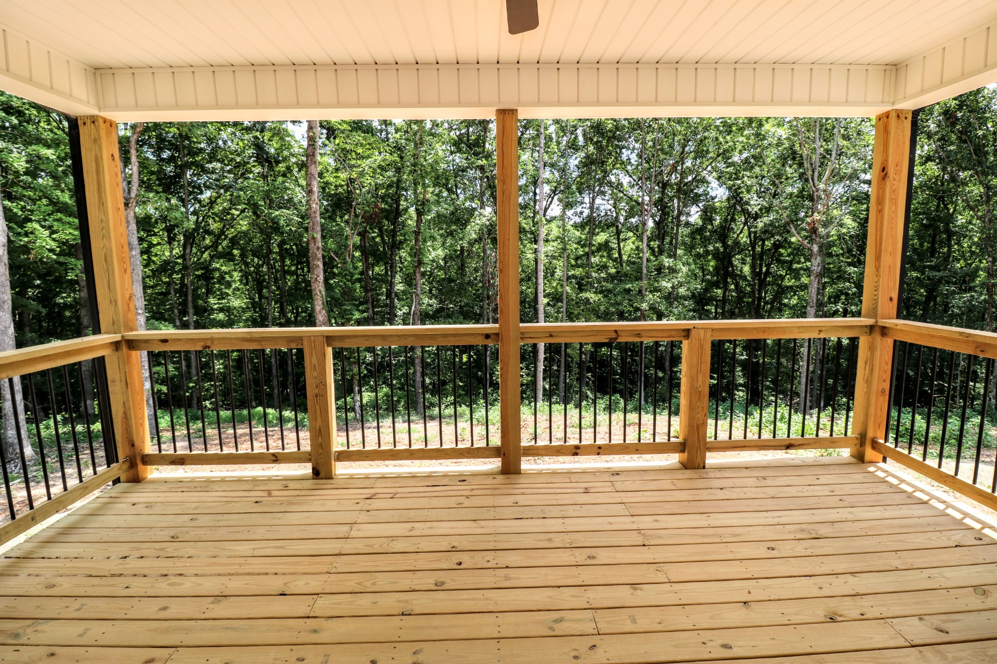 2775 Mayne Trace Road Waverly, TN 37185 - Photo 9 of 43 a view of a balcony with a floor to ceiling window and wooden floor