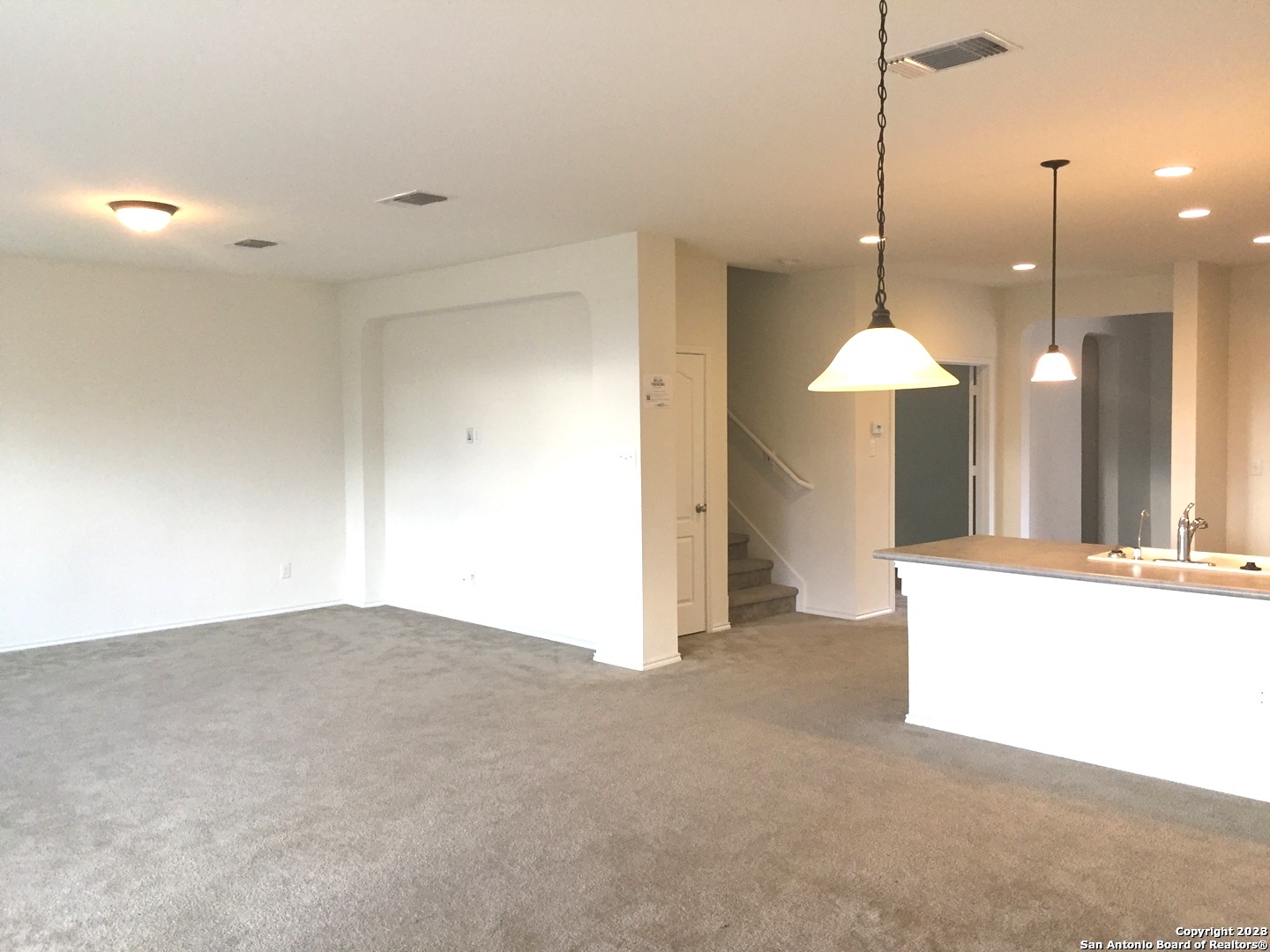 525 Granite Mist Universal City, TX 78148 - Photo 5 of 13 a view of a kitchen with a sink and a chandelier fan