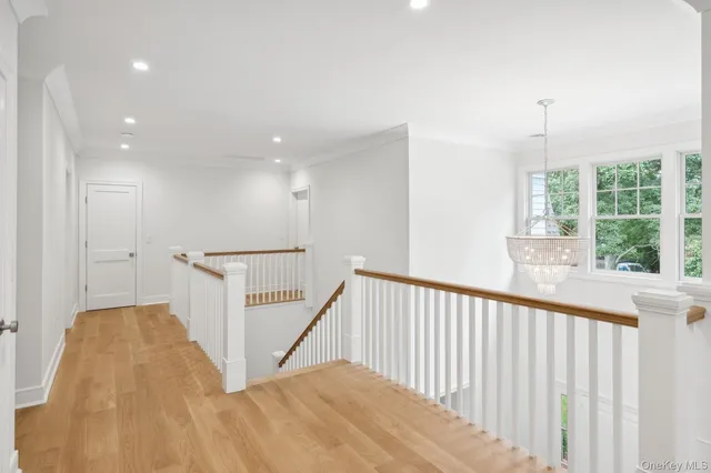 a view of a hallway with windows