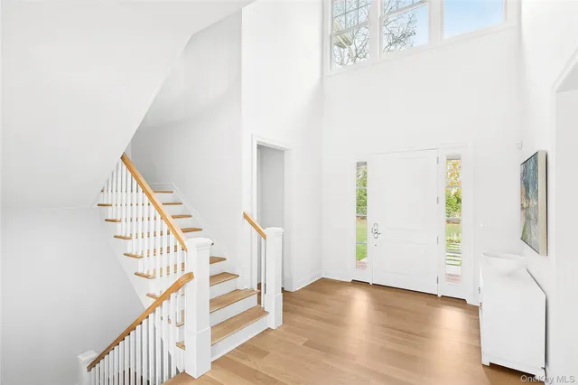 a view of entryway with wooden floor